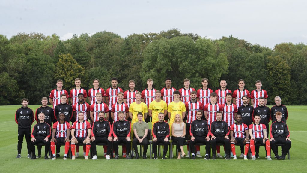 Lincoln Design and Marketing Agency Cockadoodledoo sit in on Lincoln City FC's Team Photo